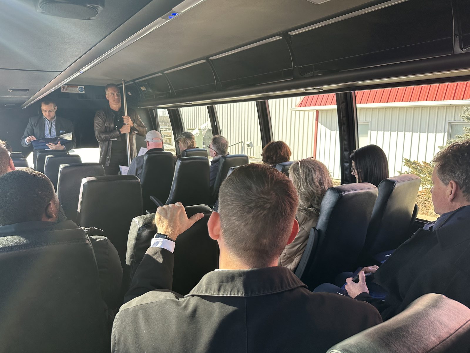 CEO briefing investors on chartered tour bus